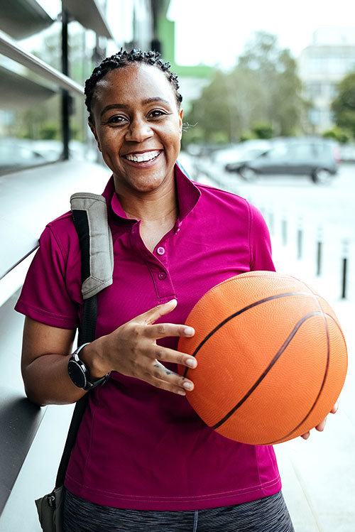 Sport agent holding a basketball
