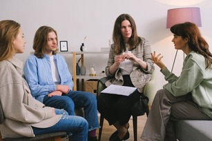 Group counseling session where participants discuss personal challenges, reflecting the psychology program’s focus on human behavior, empathy and supportive communication.