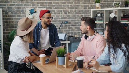 Young professionals collaborating in a modern office setting.